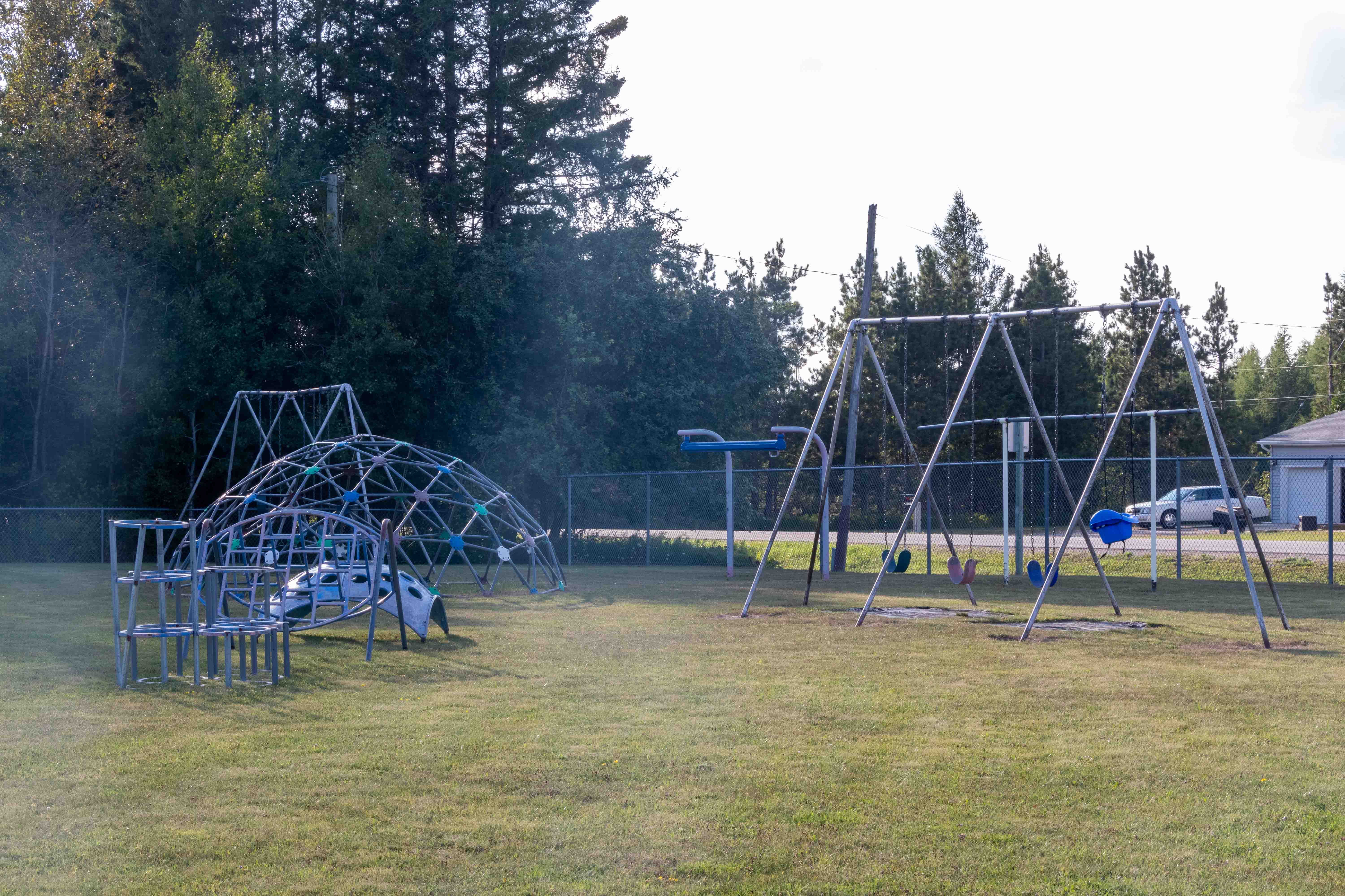 Playground with children's climbing dome and swing set